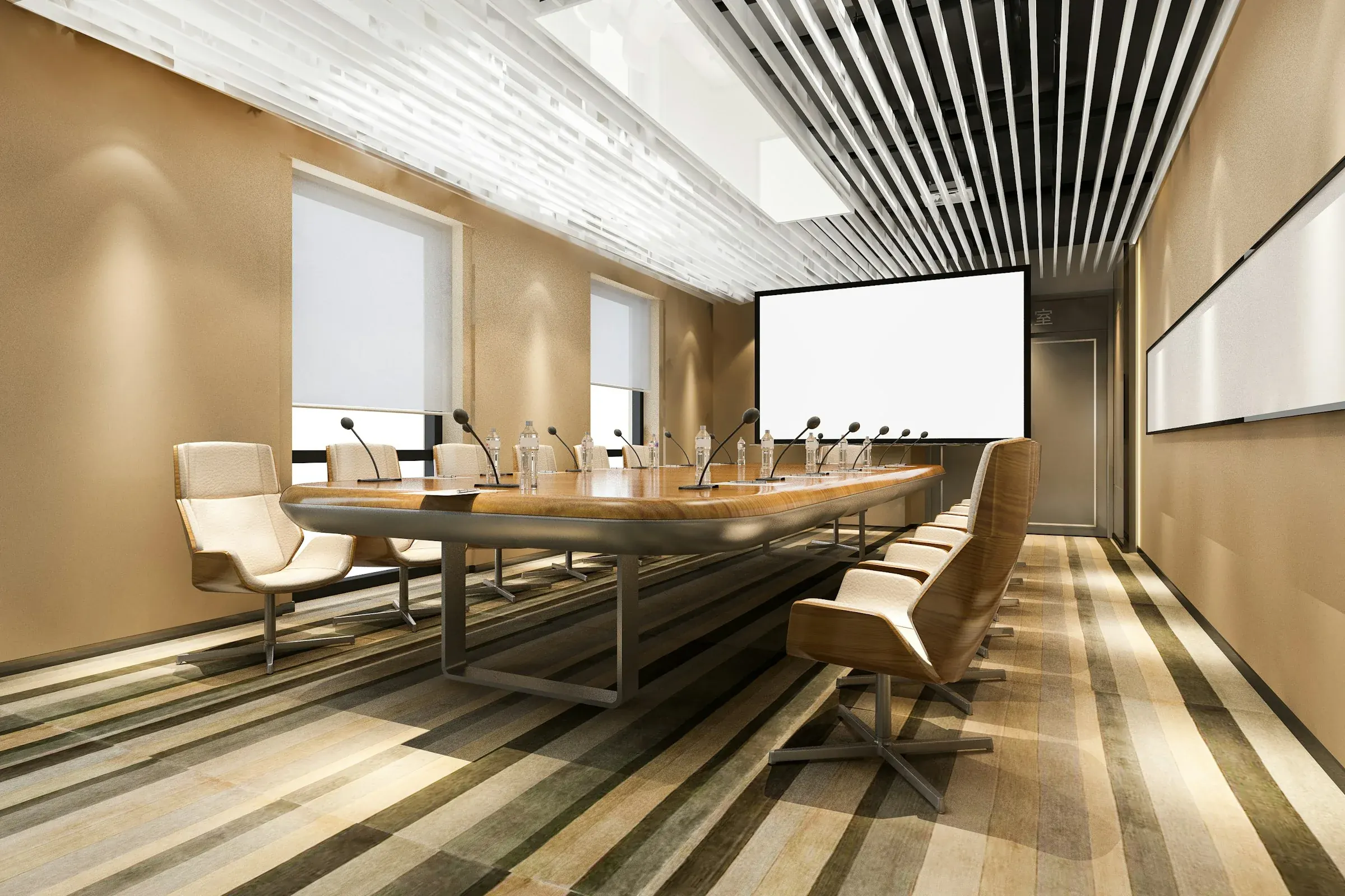 A boardroom with a long table and chairs